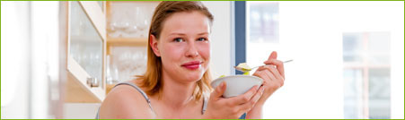 lady eating cereal with fruit